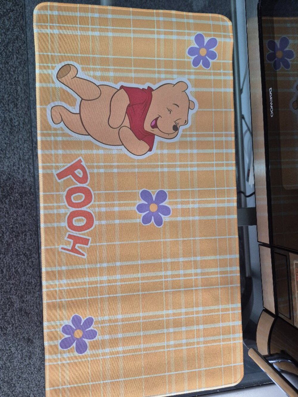 Computer key board mat with pooh bear